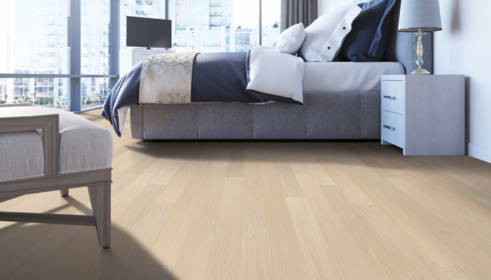 warm toned hardwood flooring in dining room with wood and glass table and wood chairs.
