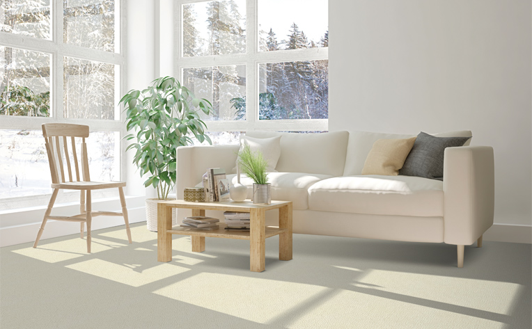 cream carpet in living room with white couch and wood coffee table