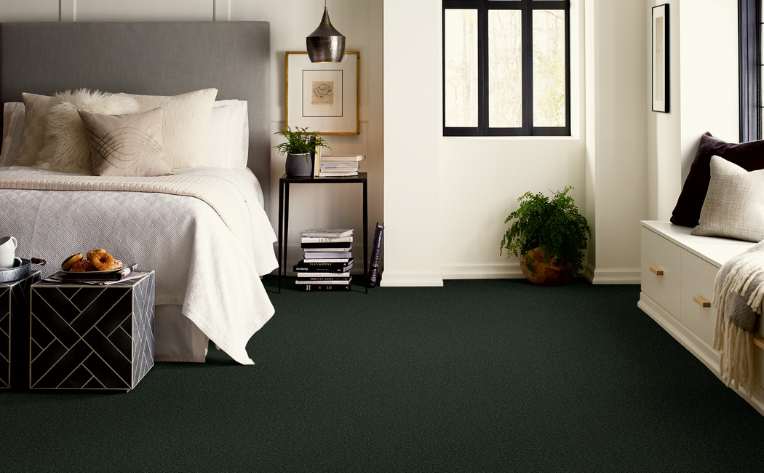 dark coloured plush carpet in modern bedroom with cosy window seat