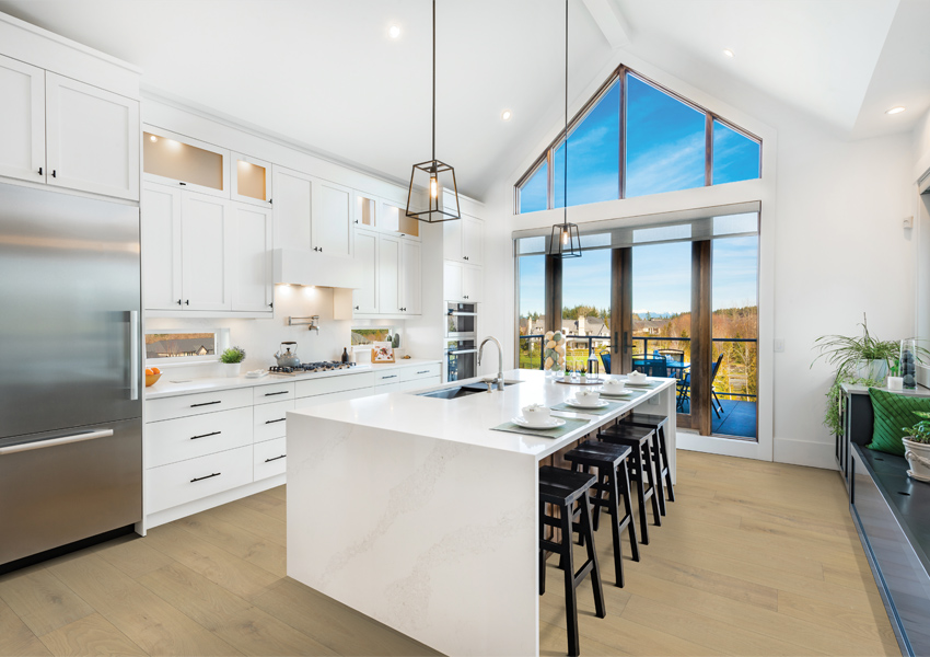 hardwood flooring in kitchen with white cabinets and biophilic interior design elements.